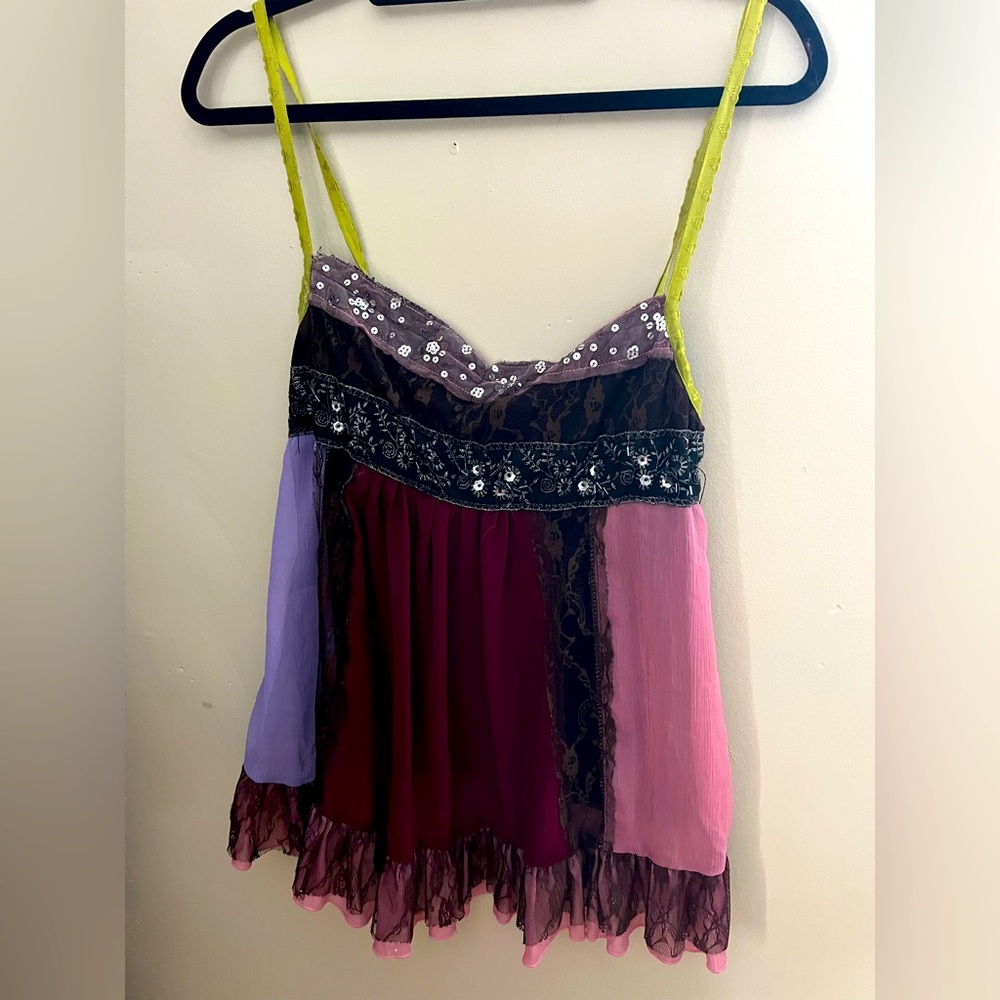 The colors in this tank are so fun! L, great condition, smoke free home.